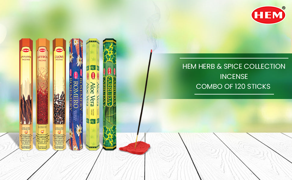 A display of HEM Herb &amp; Spice Collection incense packs with six varieties and an incense stick burning in a holder.